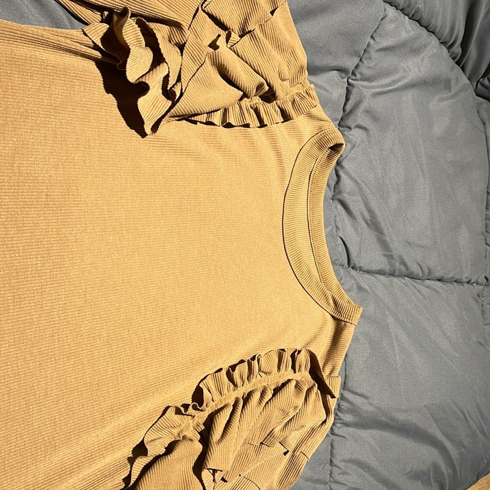 A tan blouse with ruffles on each side of shoulders - Picture 2 of 2